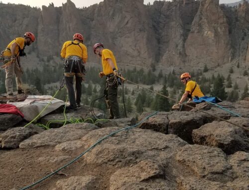 CLIMBER FALLS AT SMITH ROCK STATE PARK